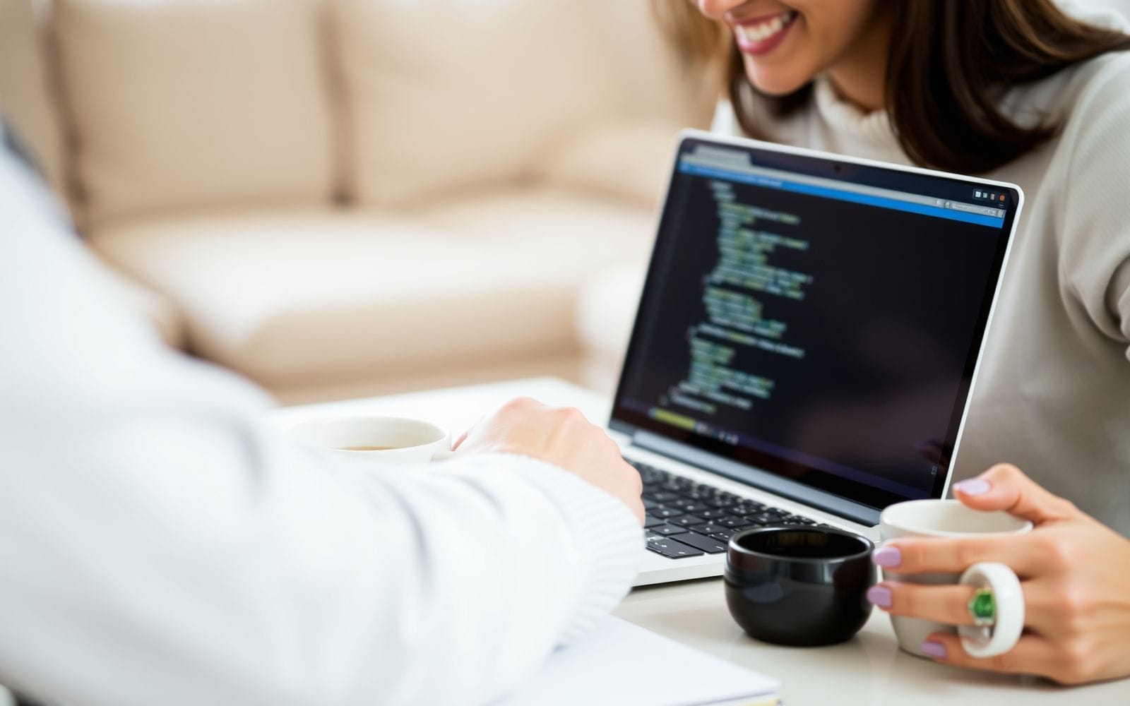 Person using AI writing assistant on laptop.